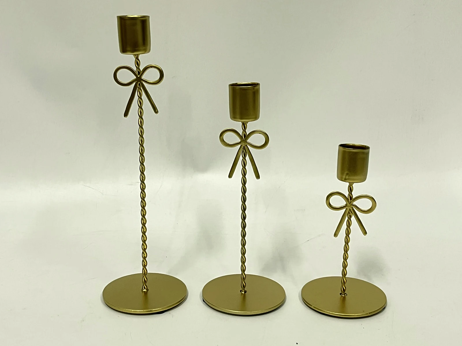 Antique-gold bow candle holders